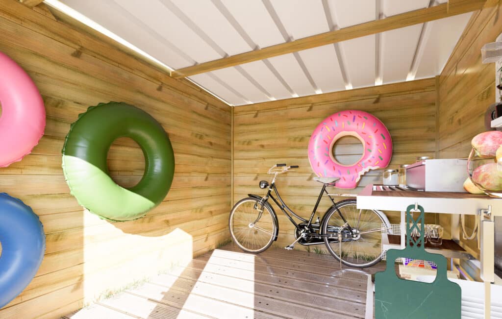 Abri de jardin en bois avec vélo et bouées gonflables décoratives