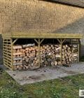 Abri à bûches 5 m × 2,27 m, adossé, avec gouttière – mise en situation